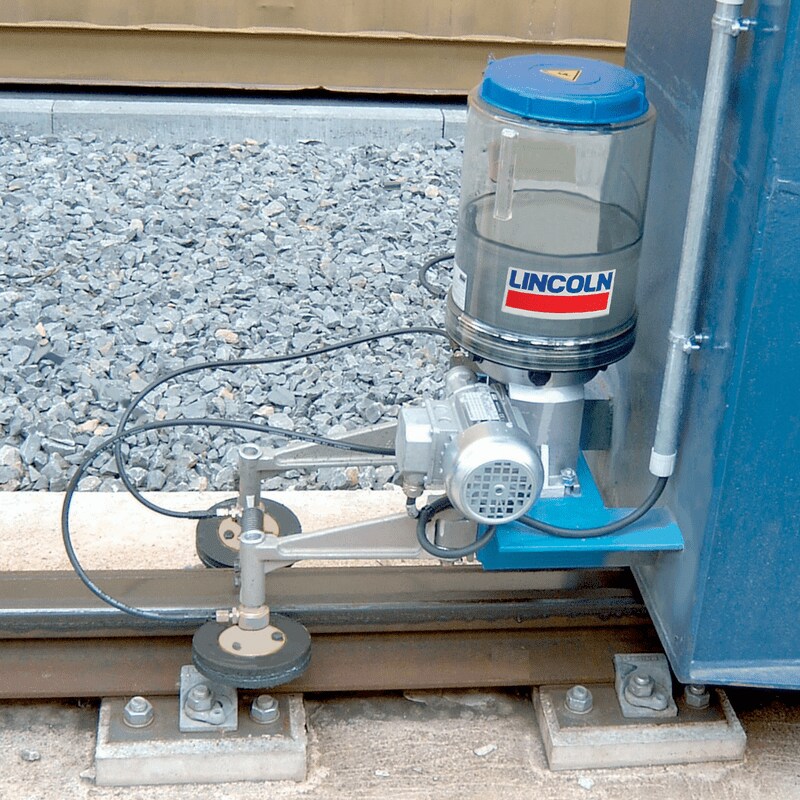 Wheel flange lubrication for slow moving rail-type cranes Wheel flange lubrication for slow moving rail-type cranes