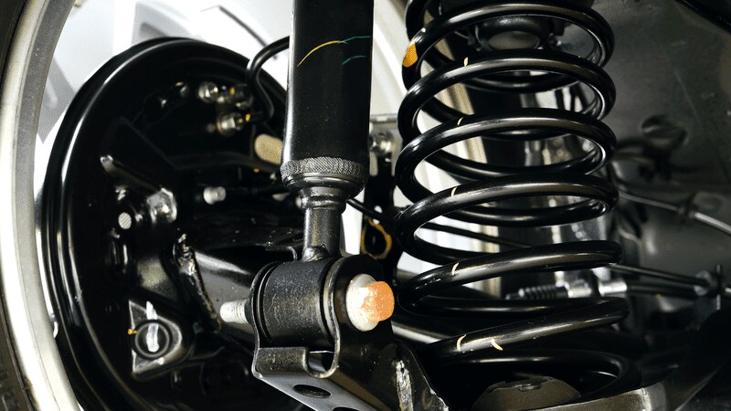 Car shock absorber and spring shutterstock_127465610