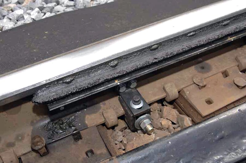 Aplicador de lubrificação lateral para linha de carga