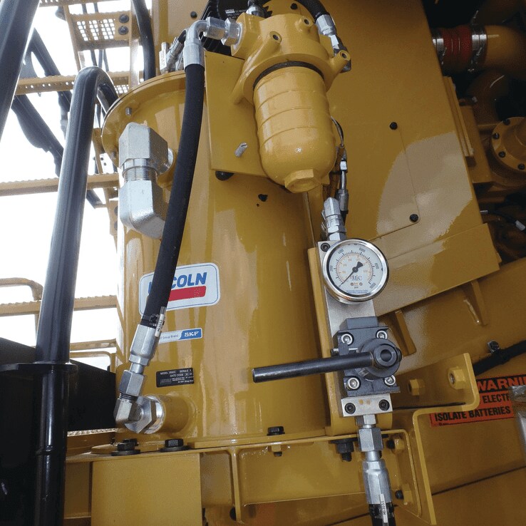 Lincoln mechanical grease overflow prevention system Lincoln mechanical grease overflow prevention system