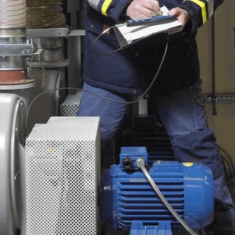Man noting MCA measurements using external sensor